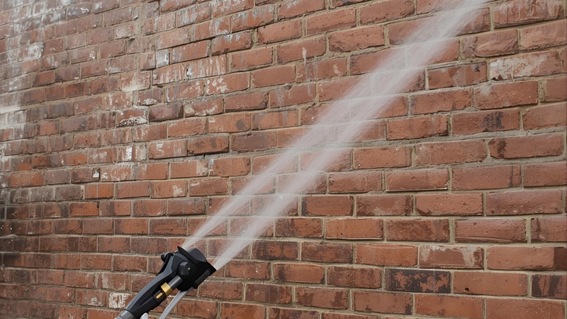 Brick wall undergoing brick cleaning service restoring natural brick texture and removing grime for durable, clean masonry exterior