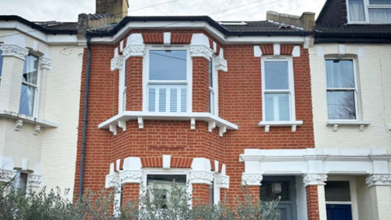 Restored brickwork wall after complete masonry restoration project in Richmond